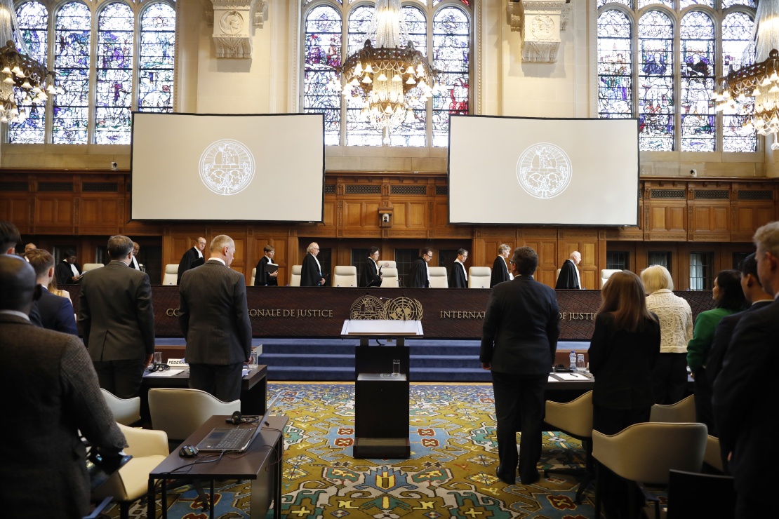 The beginning of one of the hearings at the UN International Court of Justice. The judges enter the hall.
