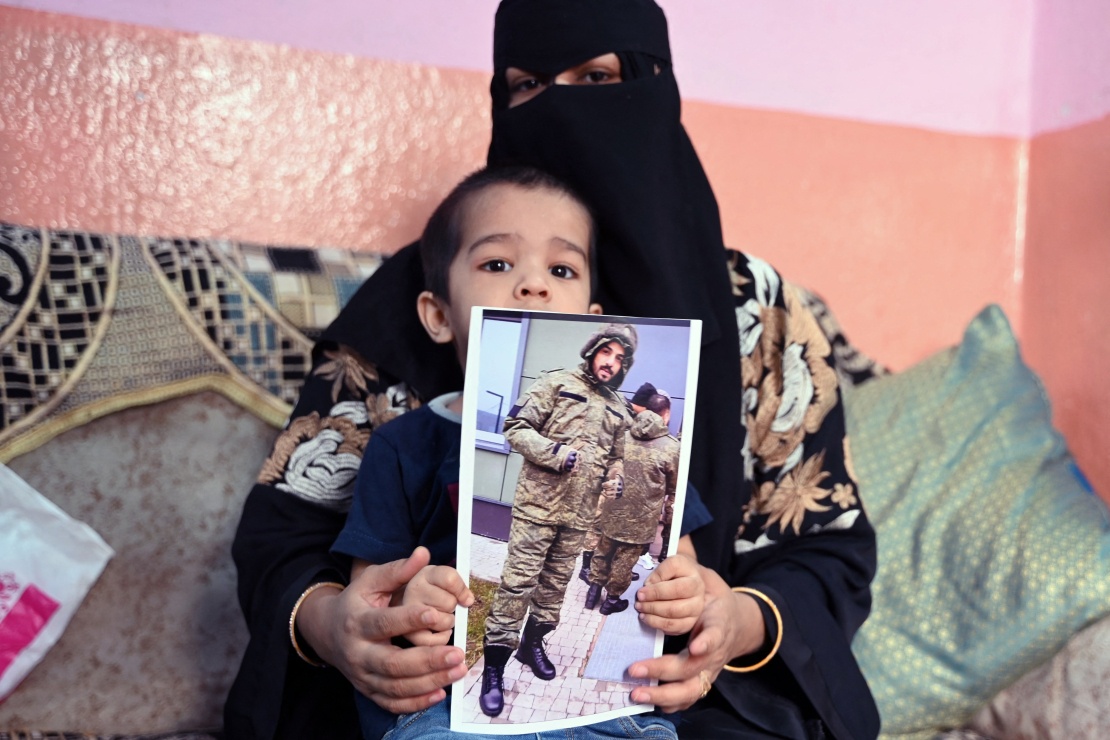 Indian woman Asma Shirin holds a photo of her husband Mohammed Asfan, who was recruited by agents to join the war in Ukraine. The last time he communicated was in Rostov-on-Don, before going to the front line.