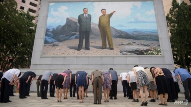 North Koreans have been ordered to protect portraits of the Kim family during the storm