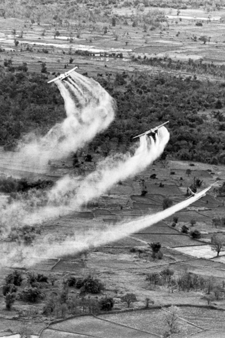 US Air Force planes spray herbicides and chemicals that are harmless to humans and animals but poisonous to plants (1966).