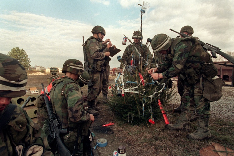 NATO peacekeepers decorate a Christmas tree during the mission in Bosnia in 1995. One of the conflicts during the Yugoslav wars of 1991-2001 took place here.
