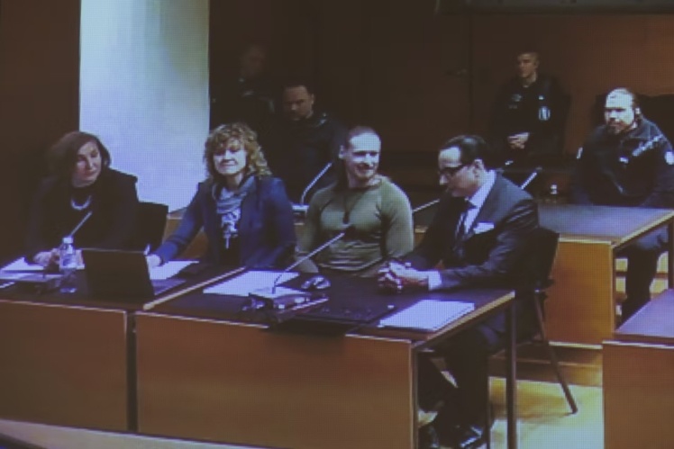 Jan Petrovskyi (second from right) at the Helsinki District Court on December 5, 2024.