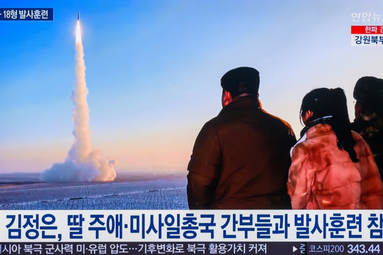 The same TV shows Kim Jong Un and his daughter, who is probably named Kim Ju Ae. They are looking at the launch of the Hwasong-18.