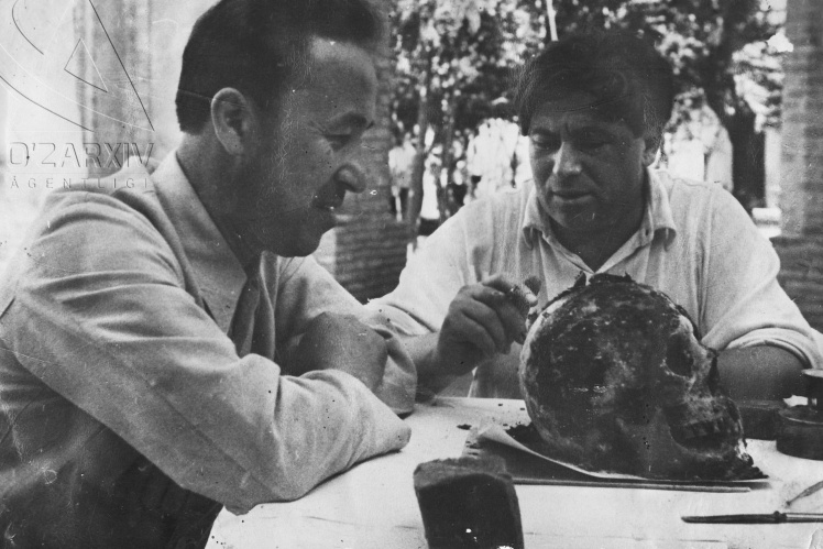 Soviet scientists examine the skull of Tamerlane, 1941.