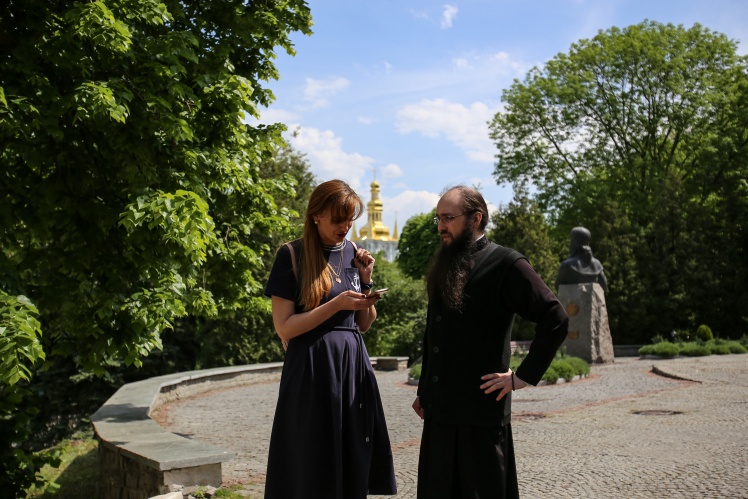 With Archimandrite Mytrofan near the building of the spiritual academy.