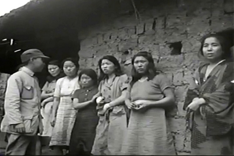 Japanese soldiers select Korean women for sexual slavery, 1940s.