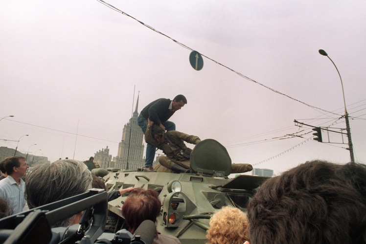An opponent of the putsch tries to throw a Soviet soldier from an armored personnel carrier in the center of Moscow, August 19, 1991.