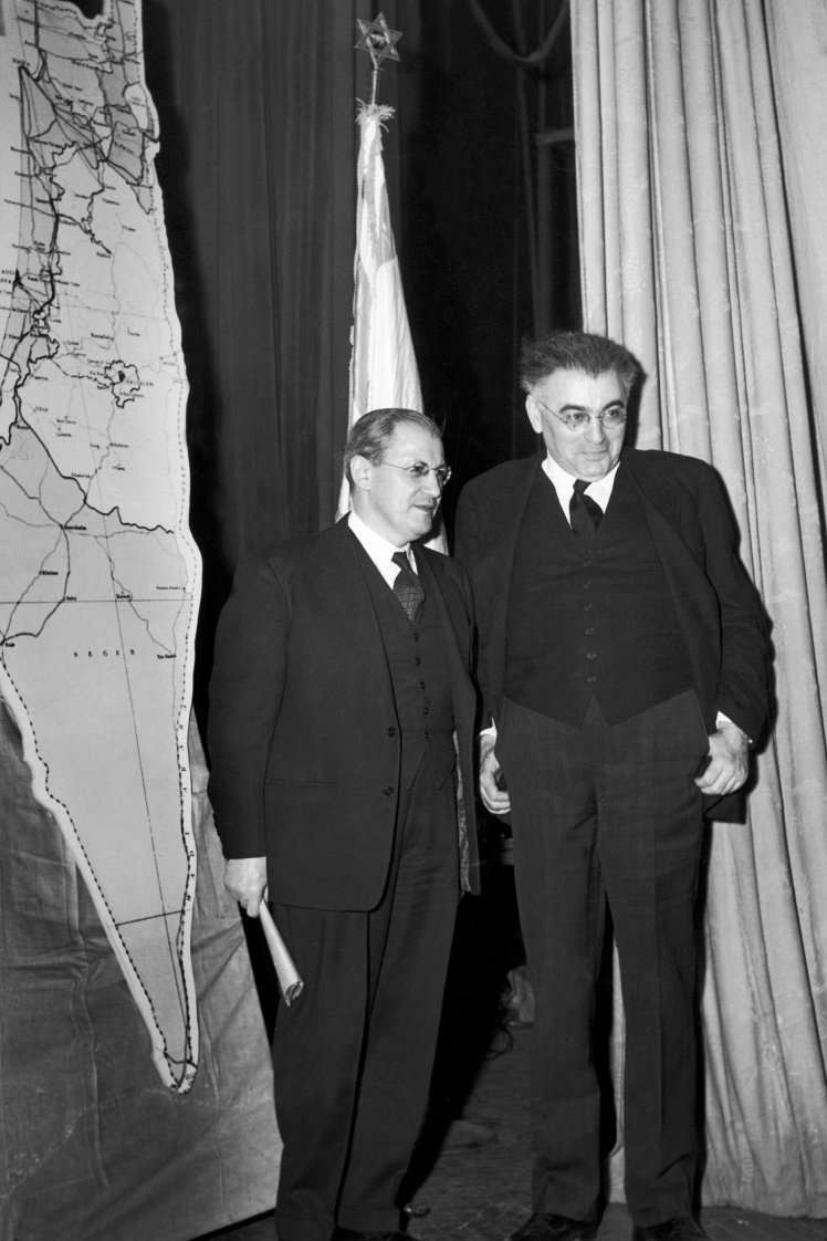 Leaders of Jewish organizations in the United States next to a mock-up of the map of the partition of Palestine approved by the UN General Assembly on November 29, 1947.