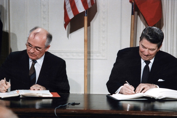 Mikhail Gorbachev and Ronald Reagan sign the Treaty on the Elimination of Intermediate-Range and Shorter-Range Missiles at the White House, December 8, 1987.
