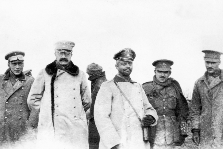 British and German officers meet on neutral ground between the trenches on the Western Front during the Christmas Truce, 25 December 1914.