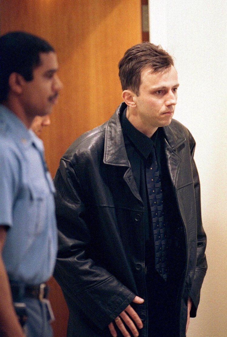 Bosnian Serb war criminal Goran Jelisic walks into the courtroom of the International Criminal Tribunal on February 22, 2001.