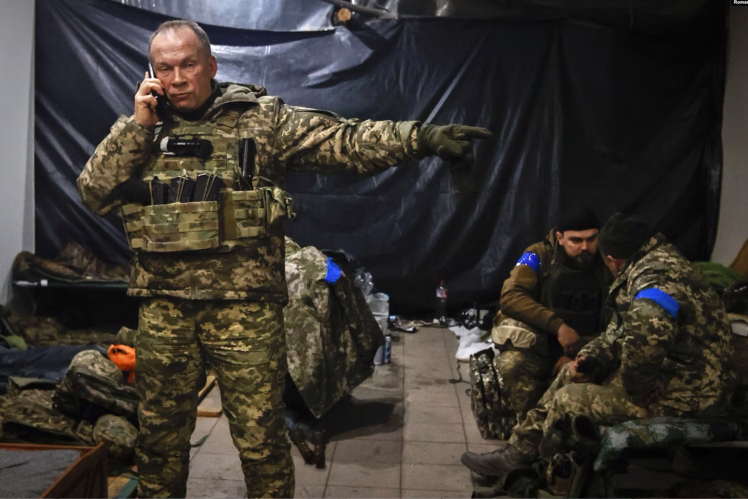 The commander of the Ground Forces of the Ukrainian Armed Forces, Colonel-General Oleksandr Syrskyi, gives instructions in a shelter during battles with the Russians, Soledar city, Donetsk region, on January 8, 2023.