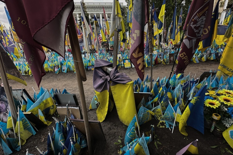 In 2024, a soldier brought a meter-long wooden cross to the memorial and wrapped it with a flag in memory of his fallen comrade.