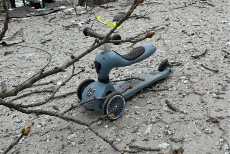 One-year-old Kira Rudykaʼs scooter at the site of a missile strike in Sumy. The child, her mother, and her sister miraculously survived. The photo of the scooter was shared on social media as an illustration of Russiaʼs war on children.
