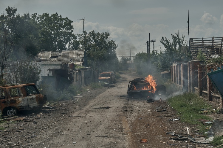 Pokrovsk, June 19, 2025. The "White Angels" evacuate civilians through burning streets; police record the aftermath of a guided bomb strike.