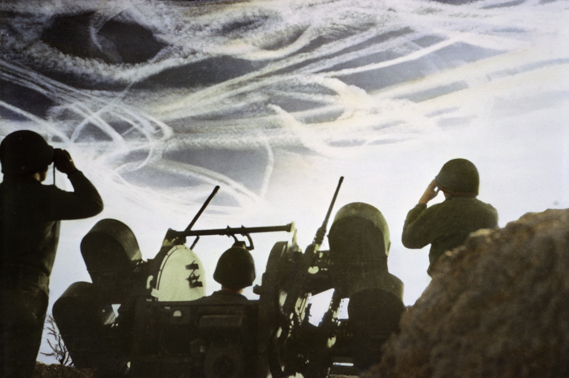 Allied anti-aircraft gunners try to aim at German planes during the Battle of the Ardennes in December 1944.