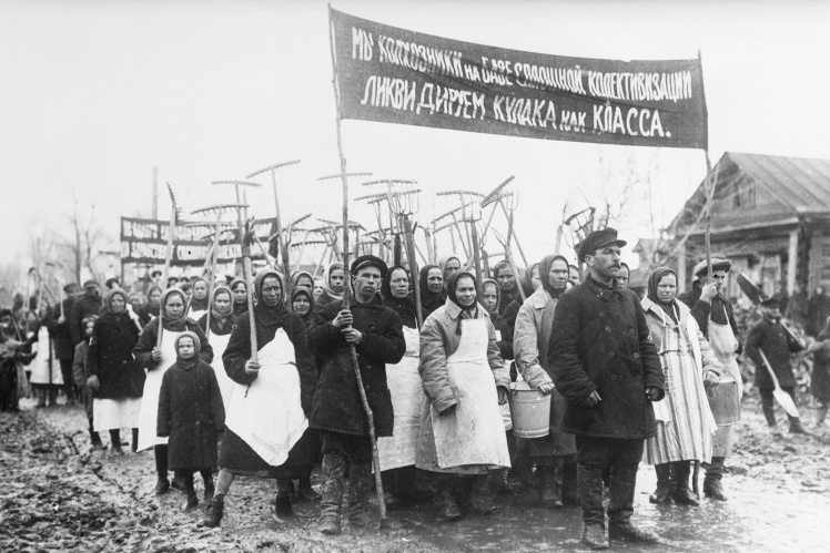 Soviet peasants with a banner with a call to fight against the "kurkuls", 1931.
