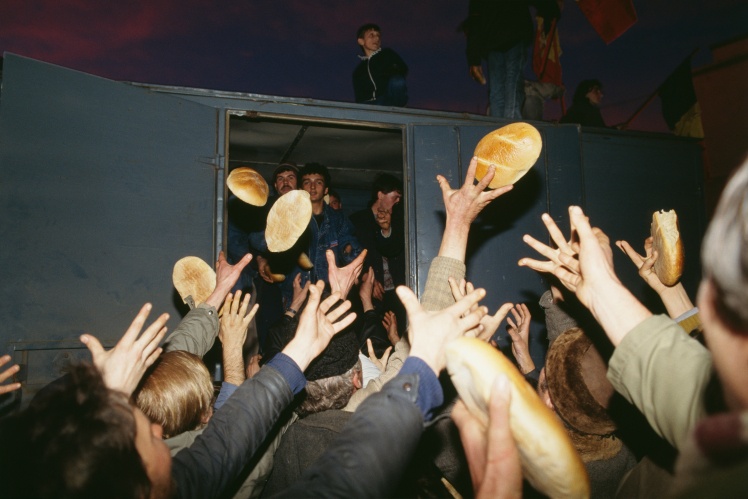 Bread is thrown to the crowd during protests in Timișoara, on December 22, 1989.