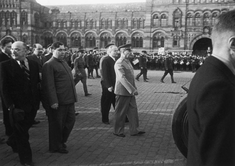 Lavrentiy Beria (far left) and Georgy Malenkov (right of Beria) walk with Joseph Stalin (center) through Red Square in Moscow, June 1946.