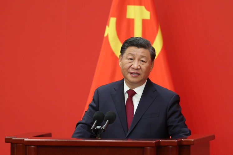 Chinese President Xi Jinping speaks from the podium during a meeting of members of the Standing Committee of the Politburo of the Communist Party of China Central Committee, October 23, 2022.