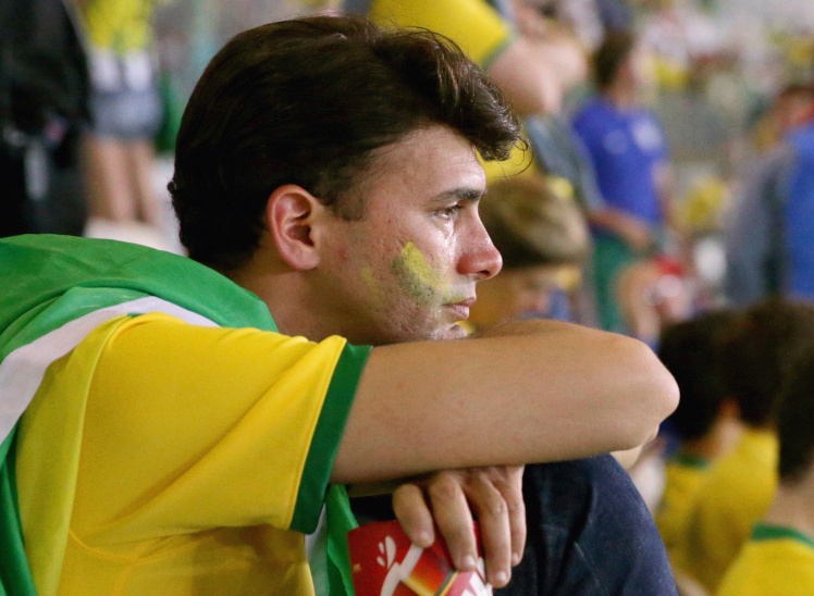 Вболівальник Бразилії на стадіоні «Мінейран» у місті Белу-Оризонті, 8 липня 2014 року.