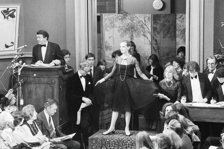 Coco Chanelʼs famous "little black dress" is sold at Christieʼs auction in London, 1978.