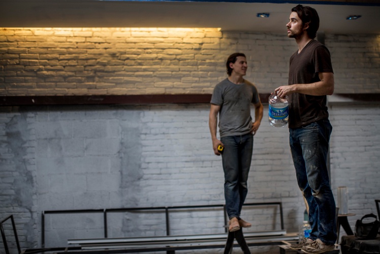 Harrison Suarez and Michael Haft renovating the new coffee shop, 2014.